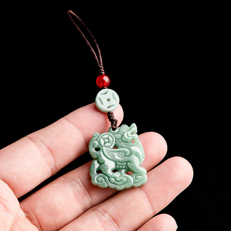 Jade Prosperity Charm – Pale green pixiu jade pendant with coin and cloud base in hand, feng shui phone charm