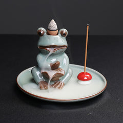 Meditation Frog Ceramic Lotus Incense Burner - Low 3/4 view with smoke cascading from lotus flower, Serene