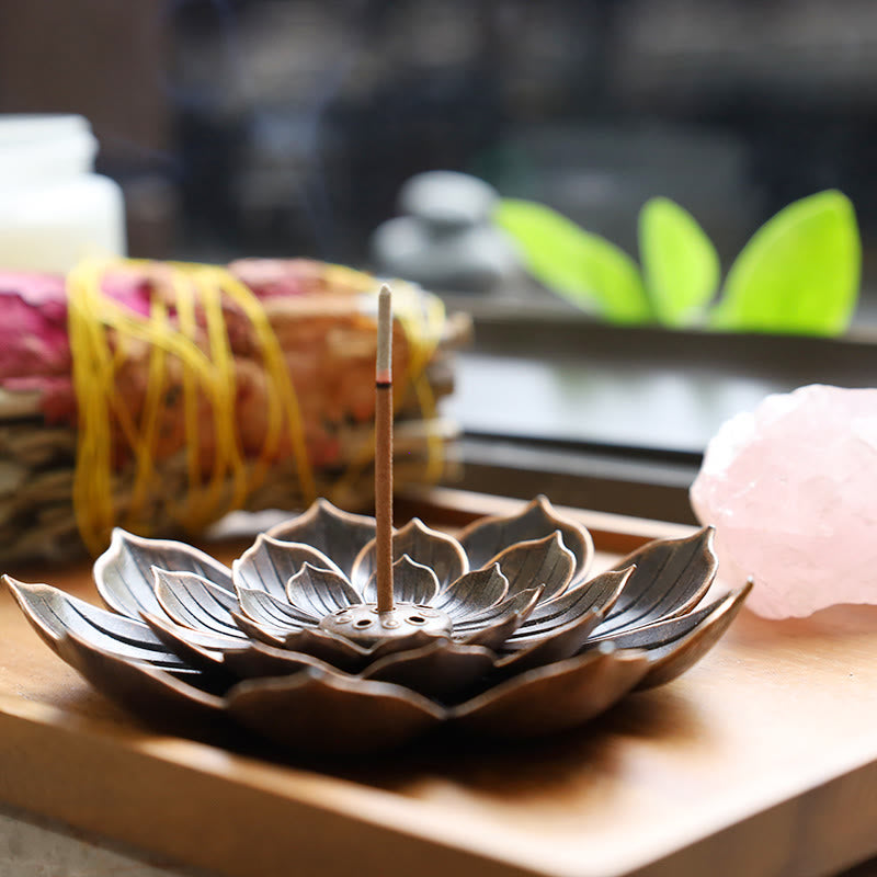 Six-Hole Lotus Incense Burner with glowing ember, bronze lotus on wooden tray, zen calm