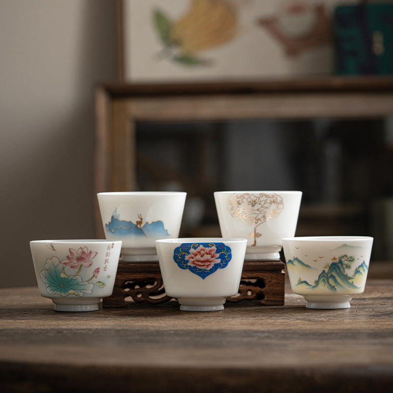 Ceramic Kung Fu Tea Cup – frontal view of blue-green mountains with pine tree, pavilion and gold outlines, refined