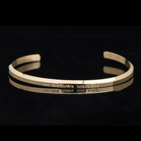 Om Mani Padme Hum Engraved Bracelet – gold cuff profile view with Tara mantra on bands, prayer bracelet