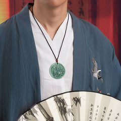 Jade Kirin Pendant – Traditional Chinese jade with dragon carving on hand in blue hanfu, prosperity necklace