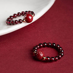 Garnet Cinnabar Ring – two rings red cinnabar bead PiXiu burgundy background, protection jewelry