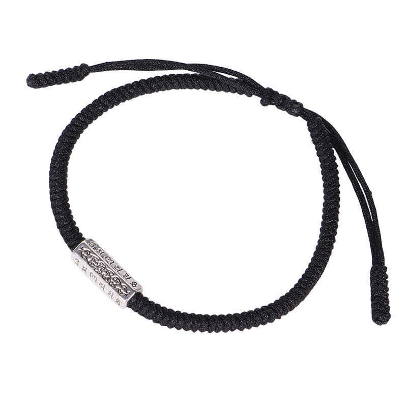 Red String Om Mani Padme Hum Bracelet - Black cord with silver mantra bead on white