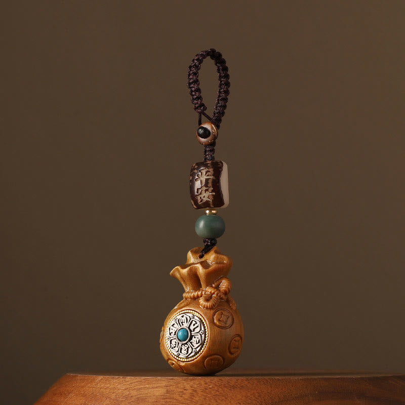 Sandalwood Money Bag Mantra Hanging - Light wood fortune bag with turquoise, wooden charm Imagen principal del producto