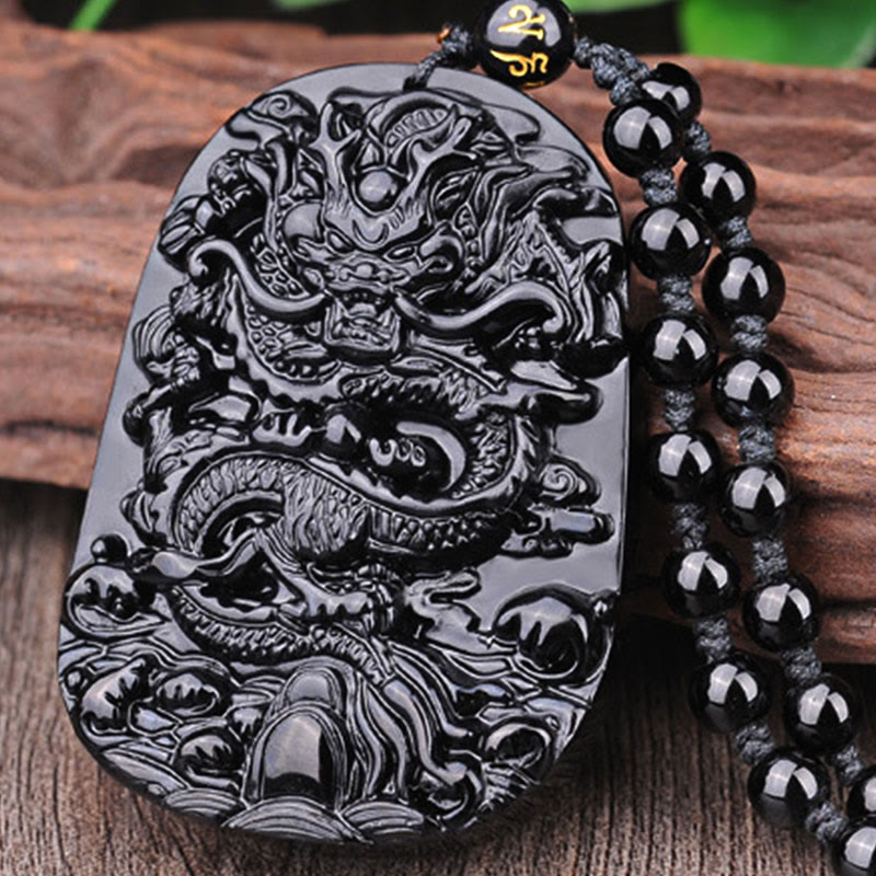 Black Obsidian Dragon Pendant – Coiled dragon plaque on natural wood slab, protective amulet