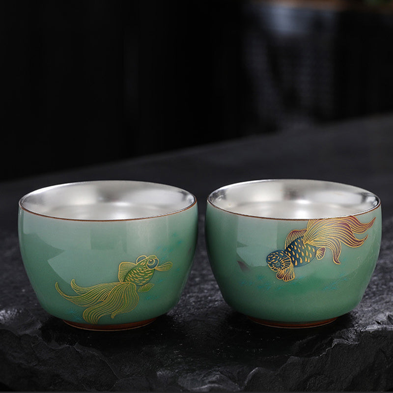 Butterfly Lotus Koi Cup – with tea inside showing contrast with glaze, Chinese tea