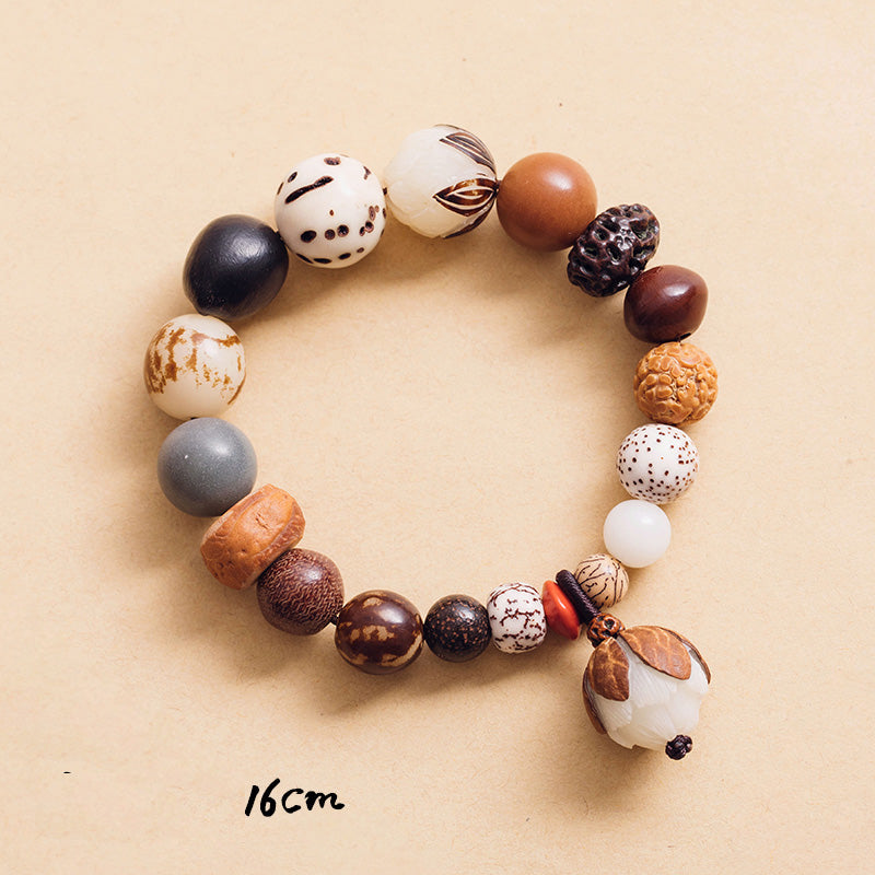 Bodhi Seed Lotus Bracelet – Circular flat lay with lotus seed pod pendant, wisdom jewelry
