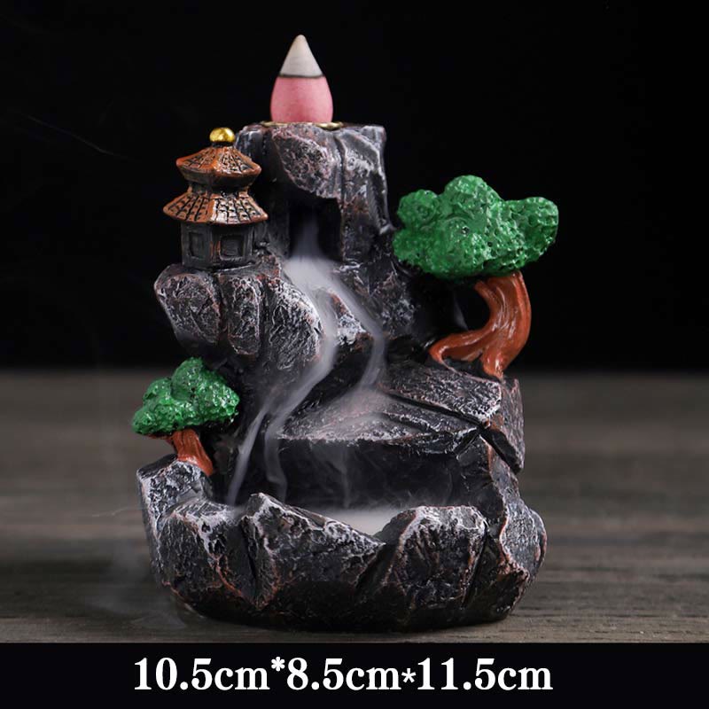 Resin Backflow Incense Burner – Rock formation with gold-tipped pagoda, trees and pink cone smoke cascade, zen