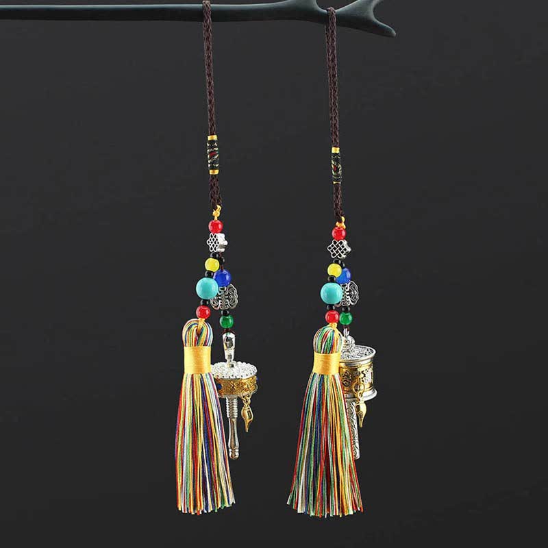 Tibetan Prayer Wheel Tassel – Matching prayer wheel ornaments with multicolored beads on black background