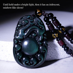 Tibetan Rainbow Obsidian PiXiu Necklace – PiXiu pendant with text overlay, rainbow sheen under bright light, obsidian wealth charm