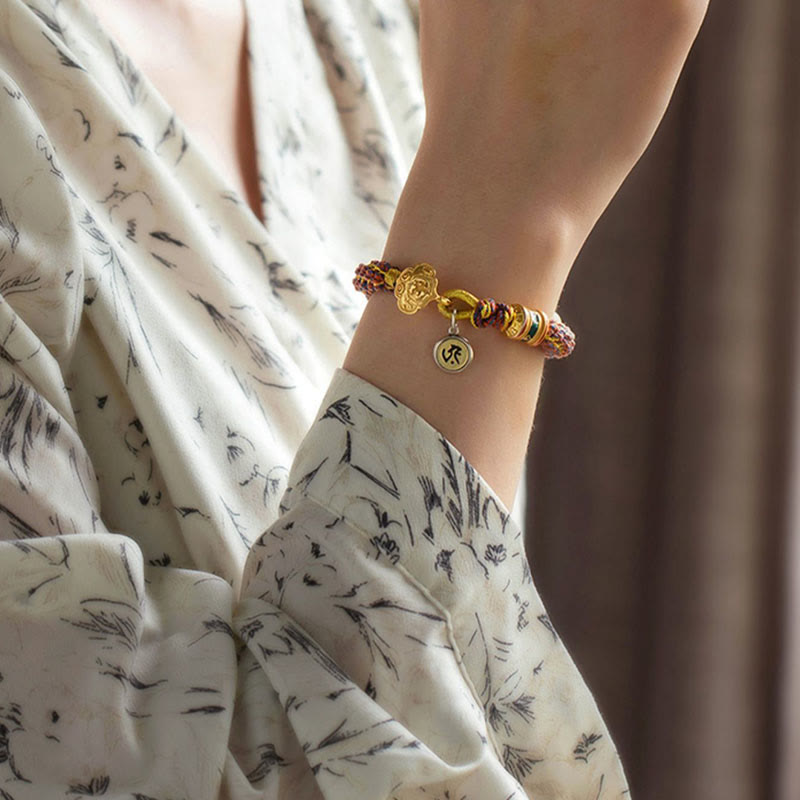 Om Mani Padme Hum Braided Bracelet – Women wrist styling with gold floral clasp and happiness character charm