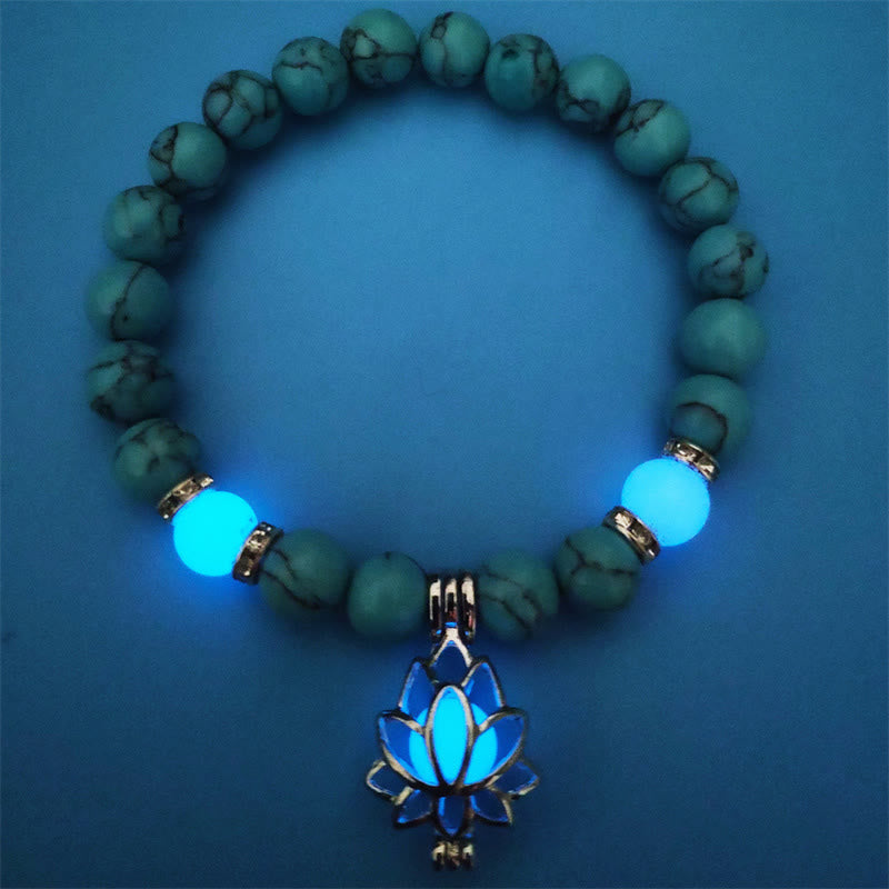 Tibetan Turquoise Glowstone Lotus Bracelet – turquoise beads with blue glowing lotus on dark blue surface, glowstone bracelet