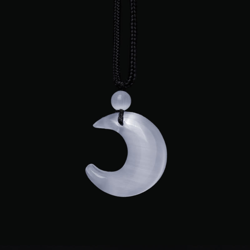 Silver Sheen Obsidian Yin Yang Pendant - Hand held close-up on model, balance necklace