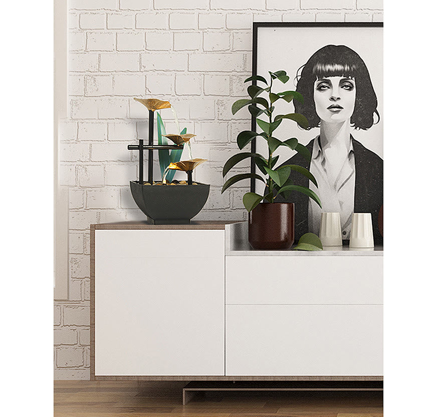Three Layers Lotus Waterfall Fountain - Gold tiers on white credenza with art and plant, Stylish