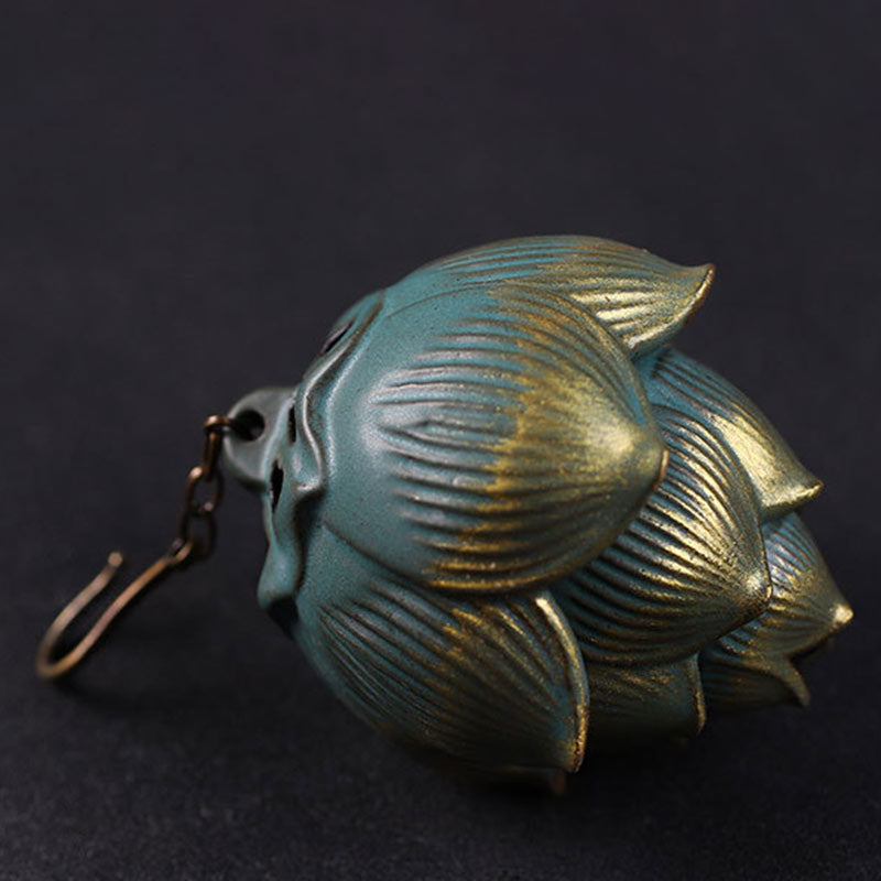 Lotus Hanging Incense Burner - Three-quarter view of layered petal bud with hook, dark backdrop, zen decor