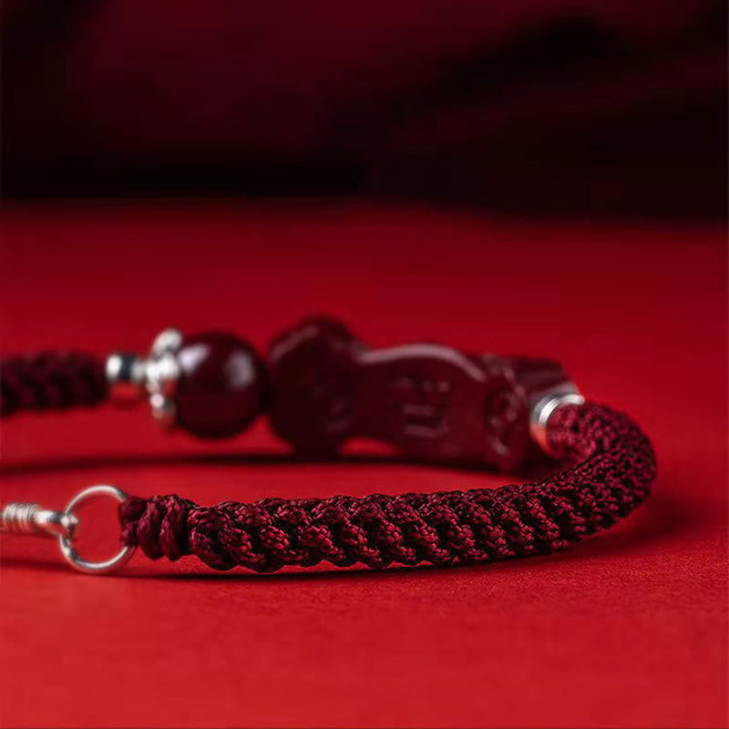 Handcrafted PiXiu Cinnabar Wealth Luck Braided Bracelet – side profile showing braided rope texture on red, detail