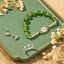 Evil Eye Bundle – Green crackle bead bracelet with pavé nazar eye charm on sage green tray with flowers