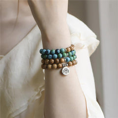108 Meditation Healing Multilayer Mala – Four-wrap bracelet on wrist with lotus charm, yoga jewelry