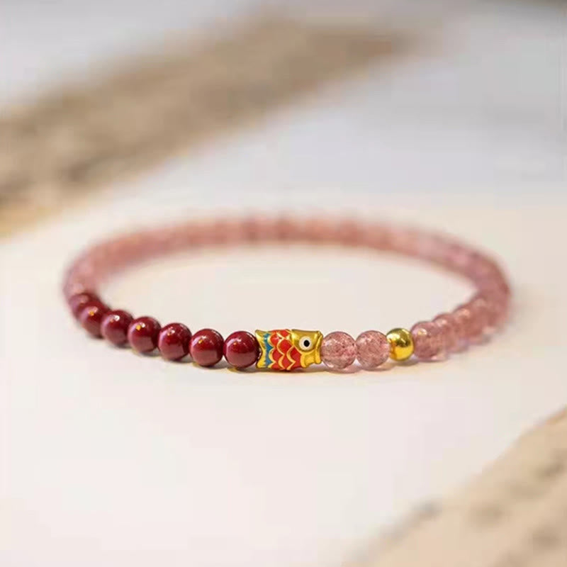Strawberry Quartz Koi Bracelet – displayed in organza bag with healing stone info card