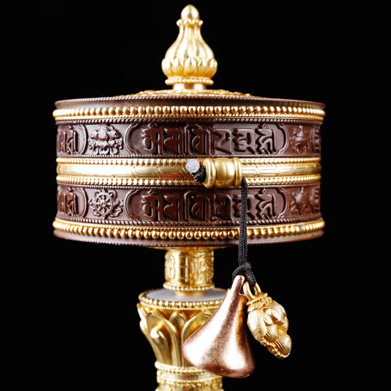 Copper Tibetan Prayer Wheel – Three-quarter view with gold filigree bands and cord counterweight, Tibetan craft