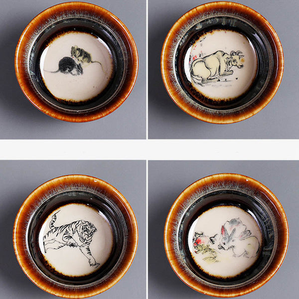 12 Zodiac Jian Zhan Teacup - Monkey Rooster Dog Pig zodiac foursome overhead view, hand-painted ink-wash animal interiors