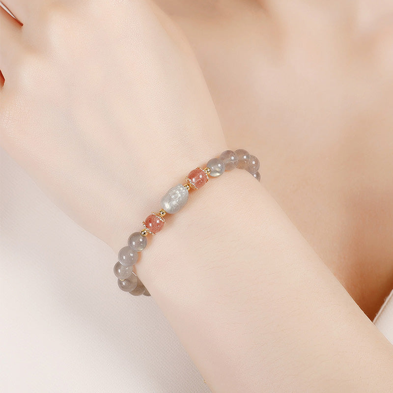 Moonstone PiXiu Bracelet – model wearing gray moonstone bracelet pink accents, love charm