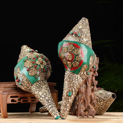 Double Dorje Shankha Conch – side angle showing double dorje prongs wrapping shell curve, vajra craft