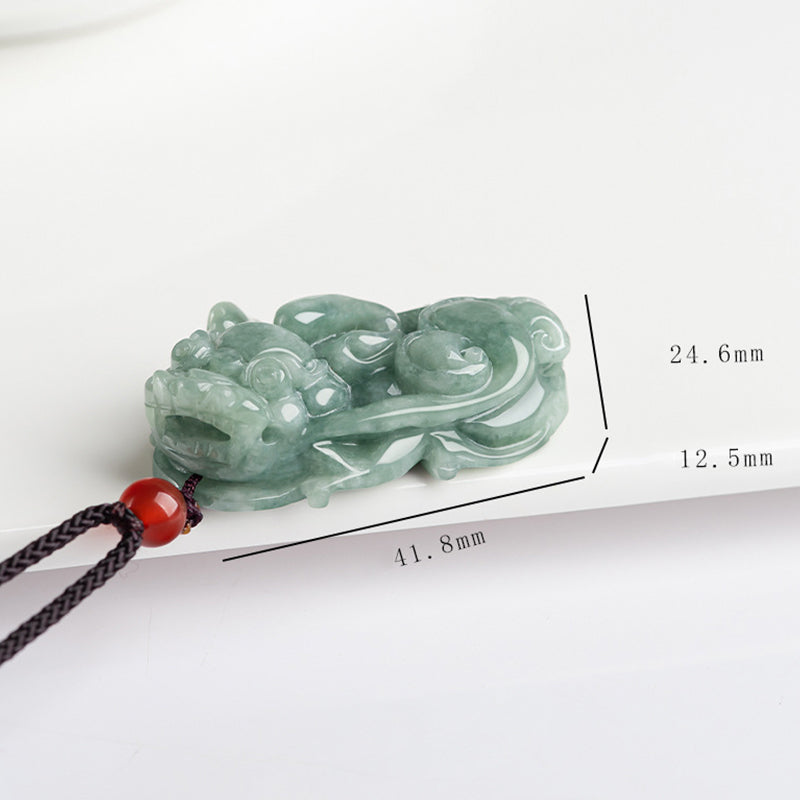 Jade PiXiu Necklace – Green jade Pixiu on dark reflective surface, another angle, wealth pendant detail