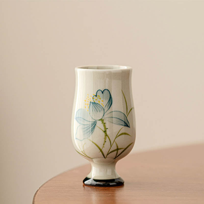 Hand Painted Lotus Tea Cup – stemmed goblet form with blue lotus on walnut wood, pedestal base, elegant serene