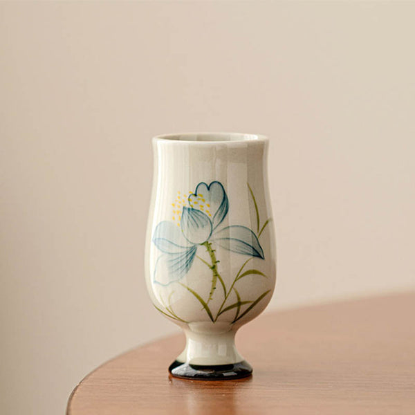 Hand Painted Lotus Tea Cup – stemmed goblet form with blue lotus on walnut wood, pedestal base, elegant serene