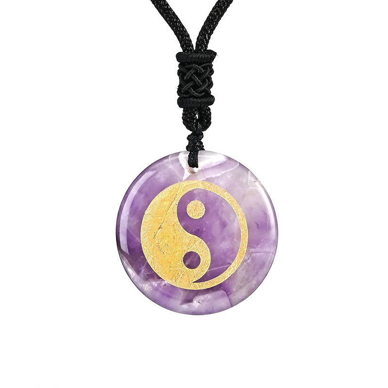 Yin Yang Crystal Necklace – Amethyst crystal pendant with gold yin-yang on black cord, natural purple stone with white veinin