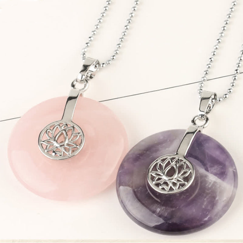 Crystal Amethyst Pink Crystal Lotus Necklace – Rose quartz and amethyst lotus donut pendants stacked, soft studio lighting, chakra healing