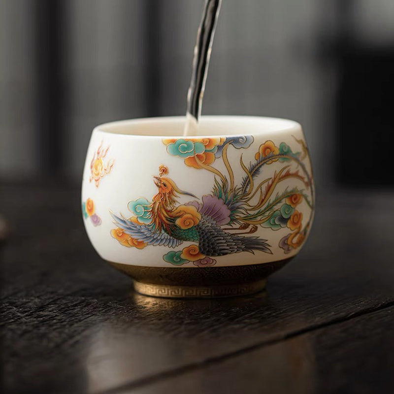 Dragon Phoenix Clouds Ceramic Teacup - Phoenix cup with tea being poured, refined