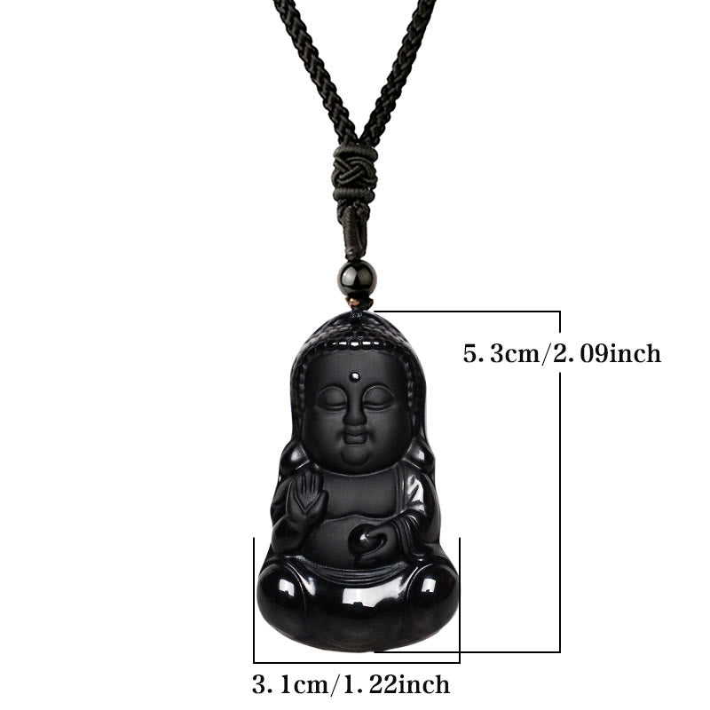 Black Obsidian Buddha Pendant Held - polished black carved Buddha resting in open palm showing actual size, Intimate