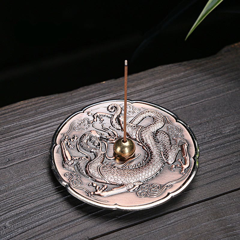 Round Dragon Copper Incense Burner - Overhead view of dragon-engraved copper plate with incense stick, meditation