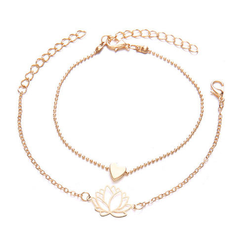 Lotus Heart Enlightenment Bracelet - Two gold layered bracelets with lotus and heart charms on white, love bracelet Imagen principal del producto