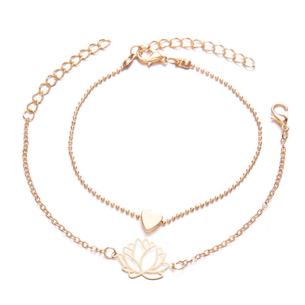 Lotus Heart Enlightenment Bracelet - Two gold layered bracelets with lotus and heart charms on white, love bracelet