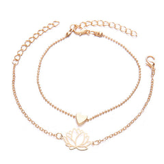 Lotus Heart Enlightenment Bracelet - Two gold layered bracelets with lotus and heart charms on white, love bracelet