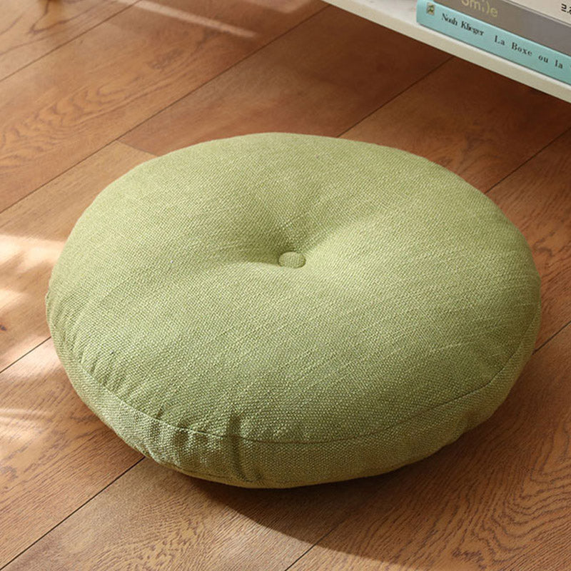 Lotus Linen Meditation Cushion – Sage green tufted on hardwood near white bookshelf