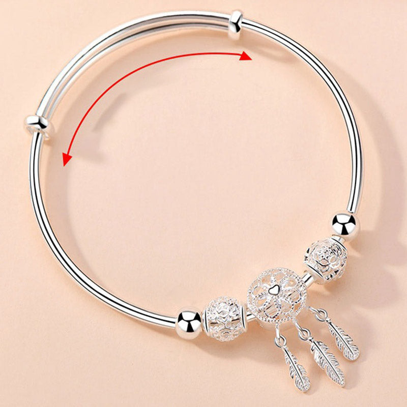 Dream Catcher Blessing Bracelet – Silver bangle with arrow showing adjustable slide mechanism, expandable bracelet