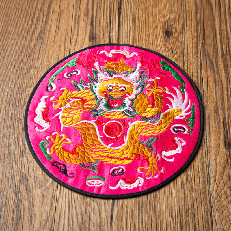 Dragon Embroidery Tea Cup Coaster Mat - fuchsia magenta base front dragon overhead on wood, vivid statement piece