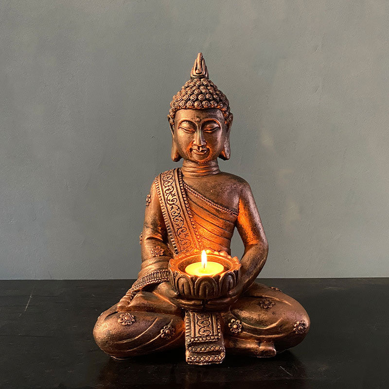 Tibetan Buddha Candlestick - Bronze meditating Buddha holding lit lotus candle, zen decor