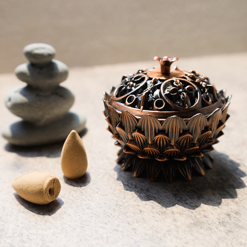 Lotus Incense Burner with ornate openwork lid, antique copper petals and cone incense, serene