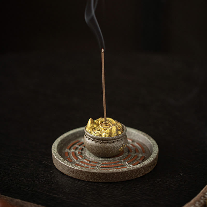 Ceramic Incense Holder – Gold lotus top on textured stone base with bagua pattern, incense smoking