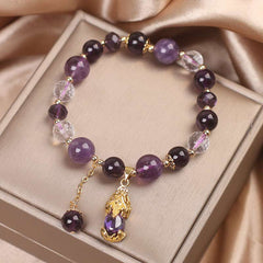 Natural Amethyst PiXiu Healing Bracelet – top-down view in beige jewelry box showing full bead circle and PiXiu pendant, healing crystal bracelet