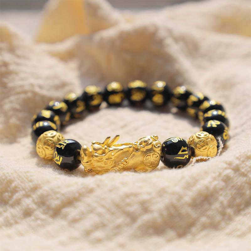 FengShui PiXiu Obsidian Bracelet – bracelet on white cream fuzzy fabric surface, black obsidian wealth jewelry