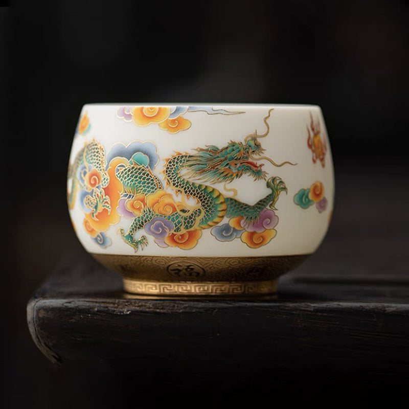 Dragon Phoenix Clouds Ceramic Teacup - Green dragon with gold cloud band on dark wood, handcrafted