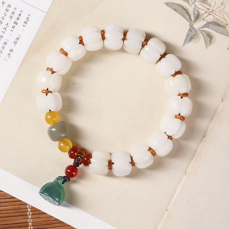 Bodhi Seed Lotus Bead Bracelet - carved white beads on calligraphy book, spiritual zen