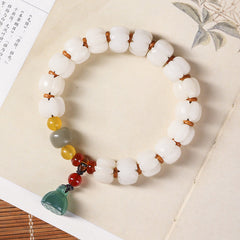 Bodhi Seed Lotus Bead Bracelet - carved white beads on calligraphy book, spiritual zen